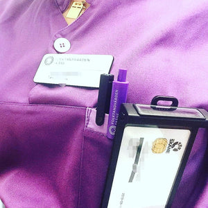 Sarah keeps her badge and time in one place.